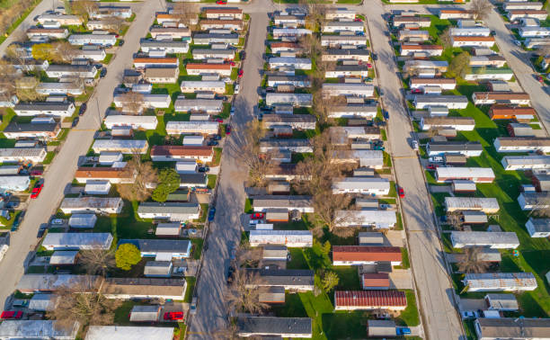 manufactured housing Aerial view looking down on vast trailer park, mobile homes.