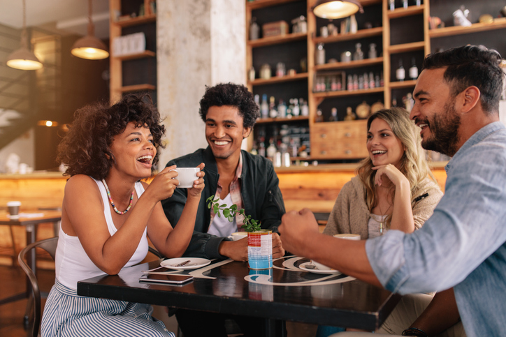 Young friends having a great time in restaurant.