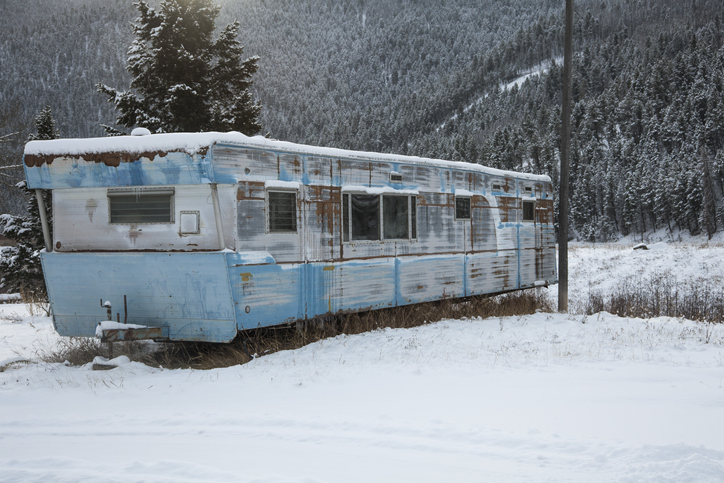 Abandoned Trailer Home with Snow