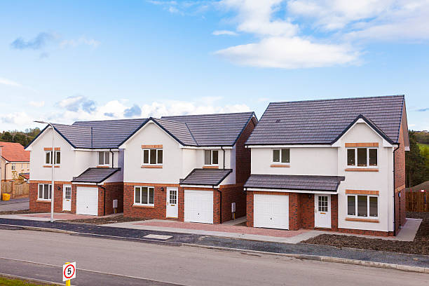 A row of newly built detached houses.