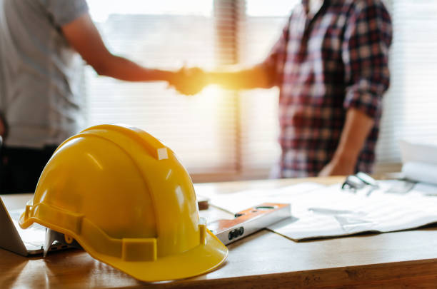 yellow safety helmet on workplace