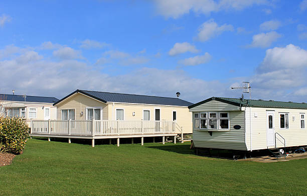 Scenic view of modern trailer of caravan park in summer.